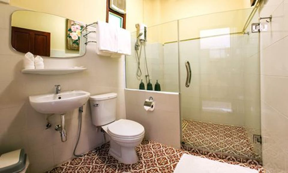 Shower, free toiletries, hair dryer, slippers