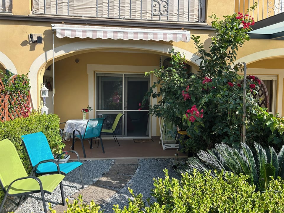 View of the garden, patio and entrance to the apartment 
