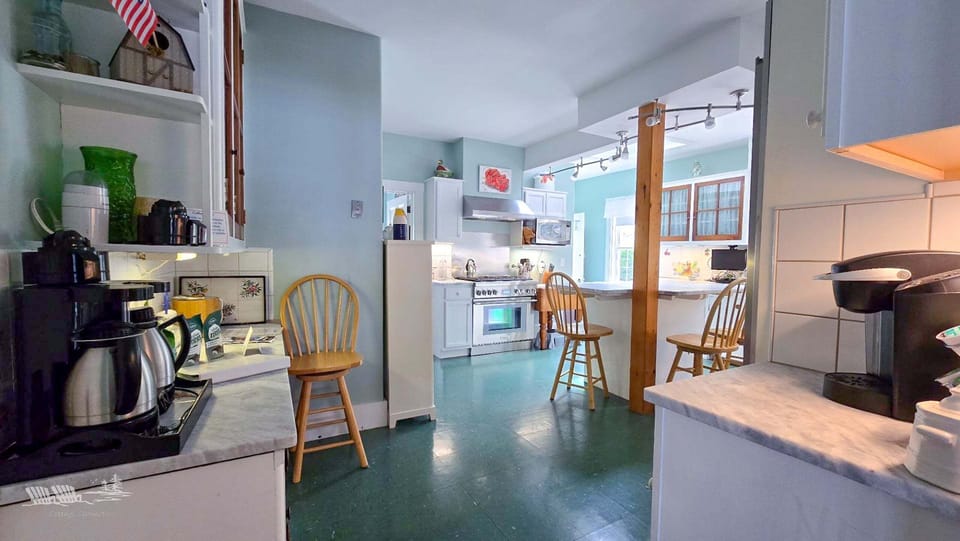 The coffee bar is next to the living room door