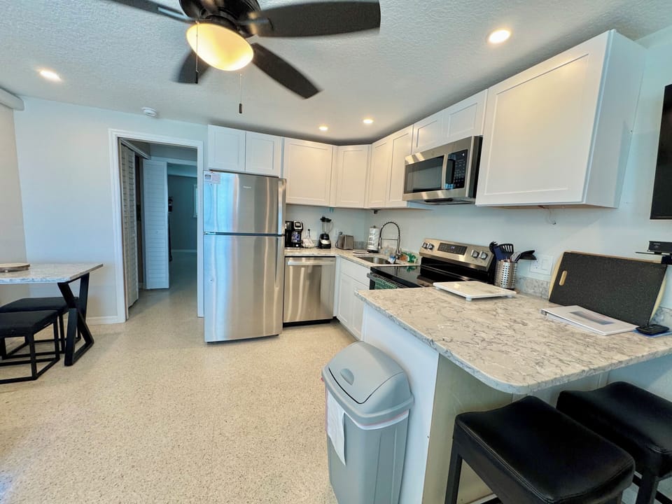 Stainless steel appliances, quartz countertops, quality smaller appliances