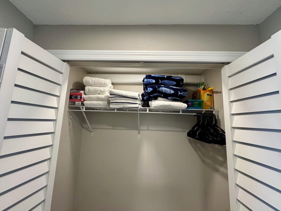 Sofa bed queen sheets, soft blanket and spare towels in the hall closet