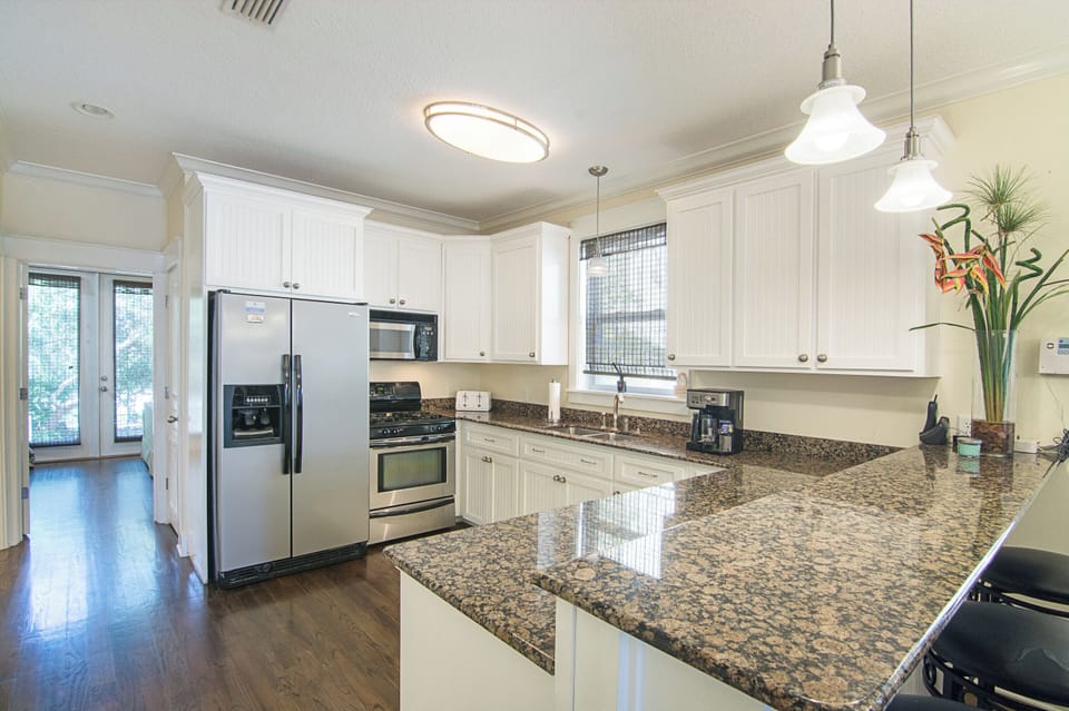 Large kitchen with granite counter tops and stainless appliances