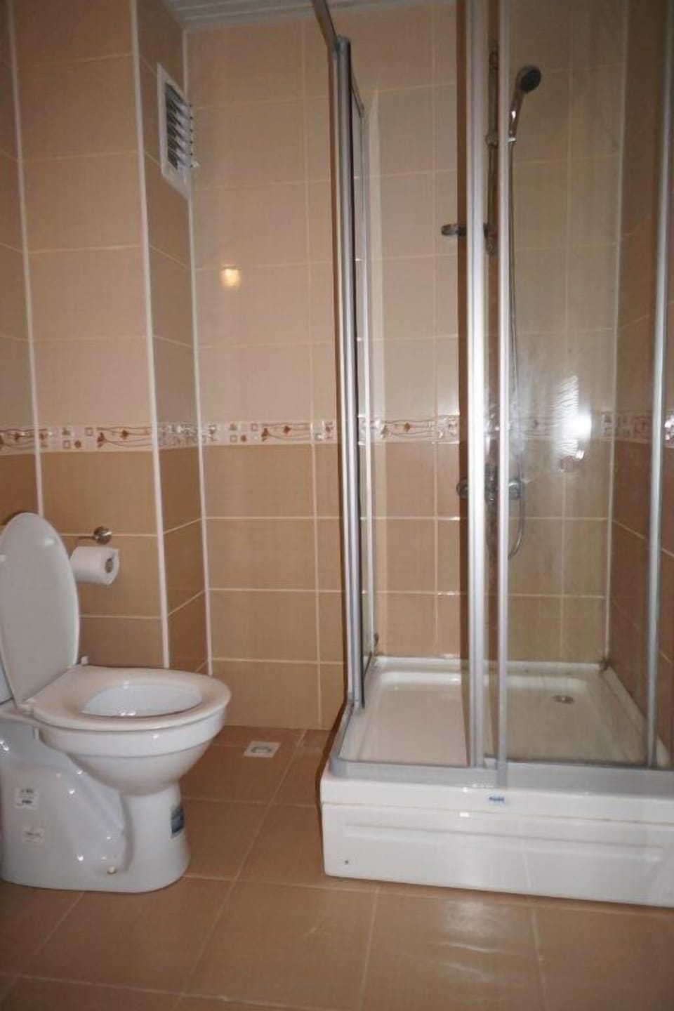 Shower, hair dryer, slippers, towels