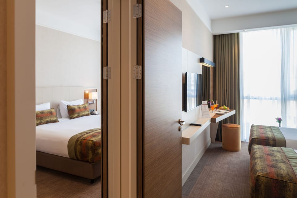 Premium bedding, minibar (some free items), in-room safe, desk