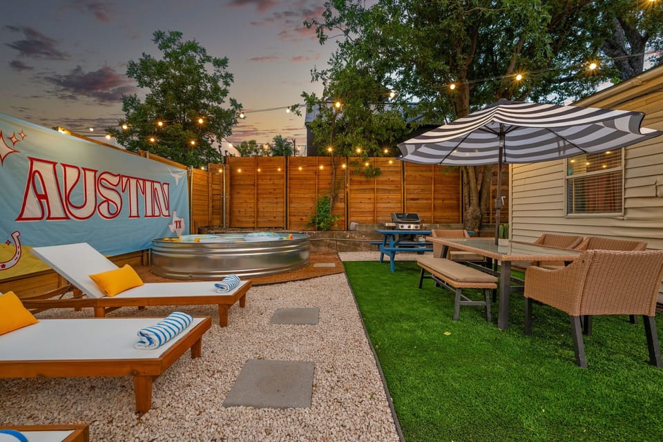 Cool off in the stock tank pool while grilling on the Weber Grill