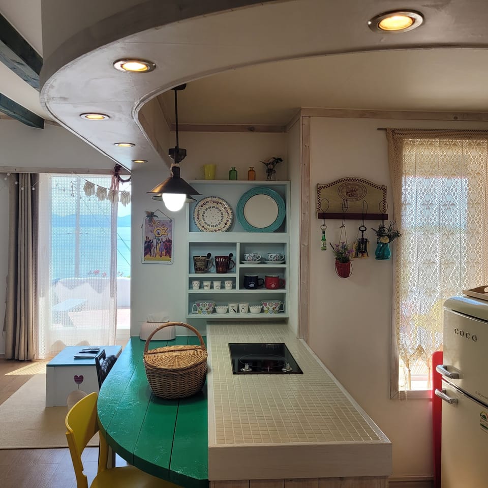 Double Room, Sea View | Private kitchen | Full-size fridge, microwave, stovetop, coffee/tea maker