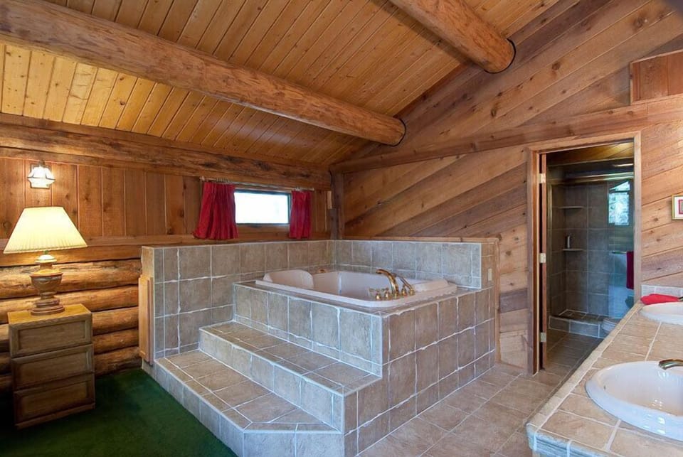 Master Bedroom with loft and private 2-person Jacuzzi tub and shower.