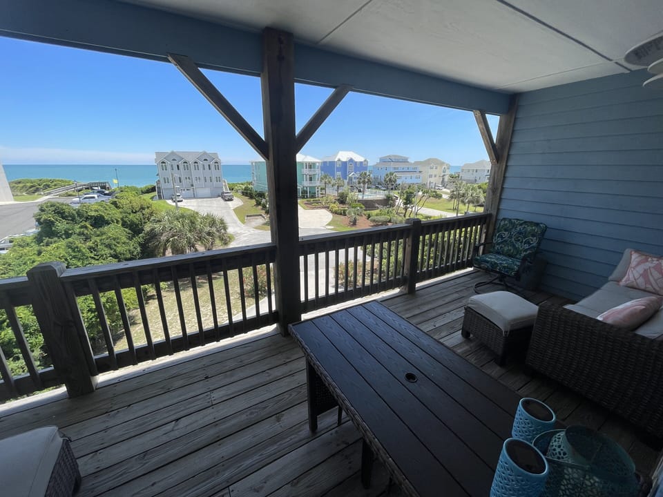 Porch off of queen bedrooms with couches