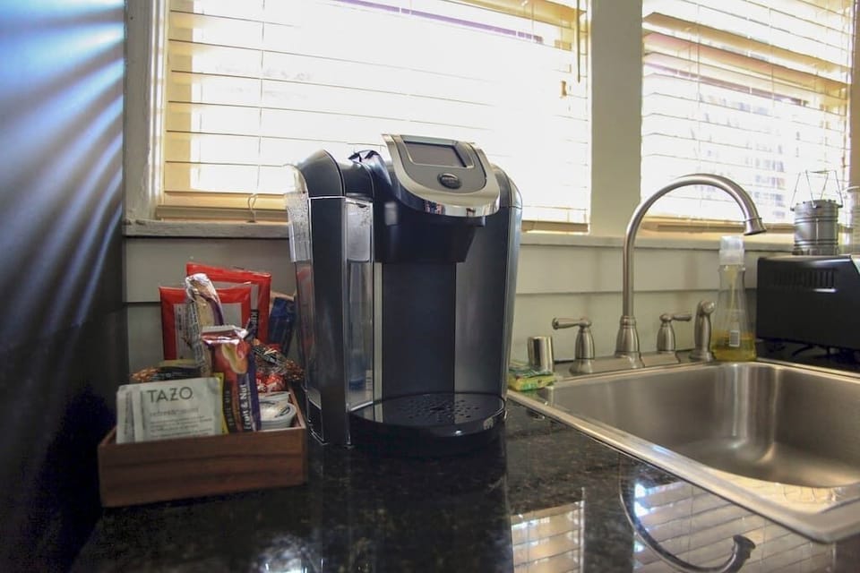 Everything you need, including Kcup coffee and machine, even down to clean sponges for the sink, is provided.