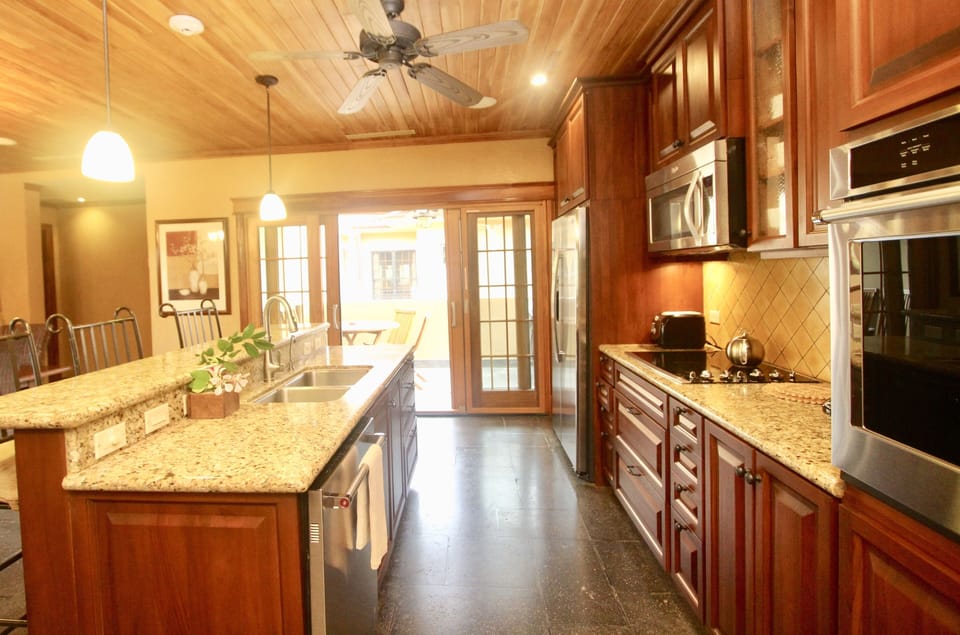 Another balcony off kitchen with beautiful weber barbeque and dining