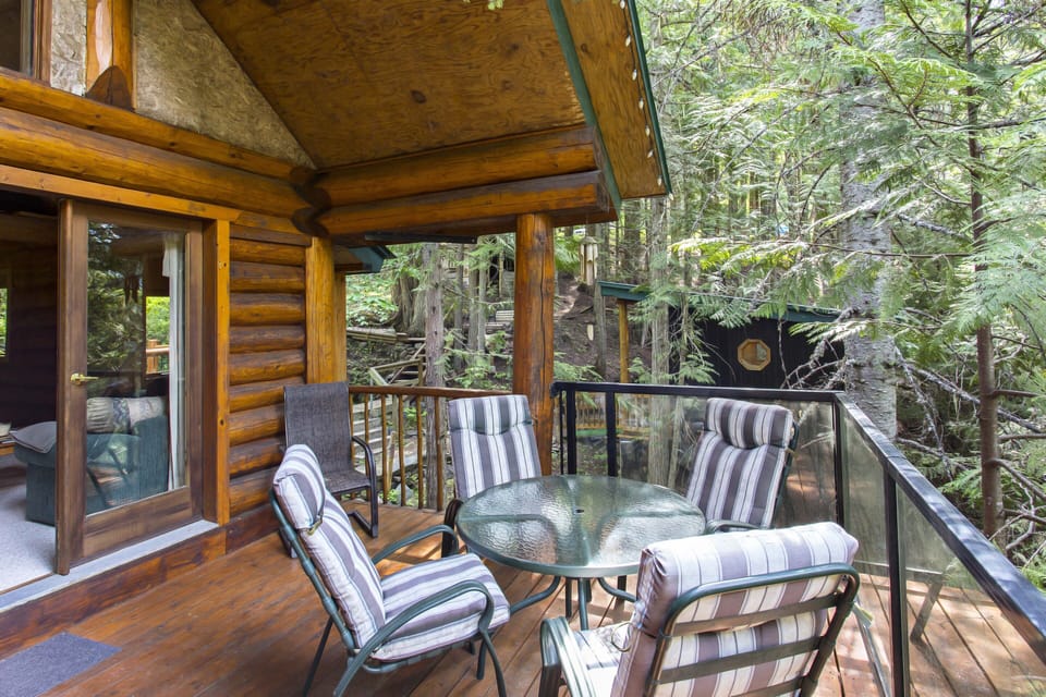 Outside deck off of main living space. View of the guest cabin in the background