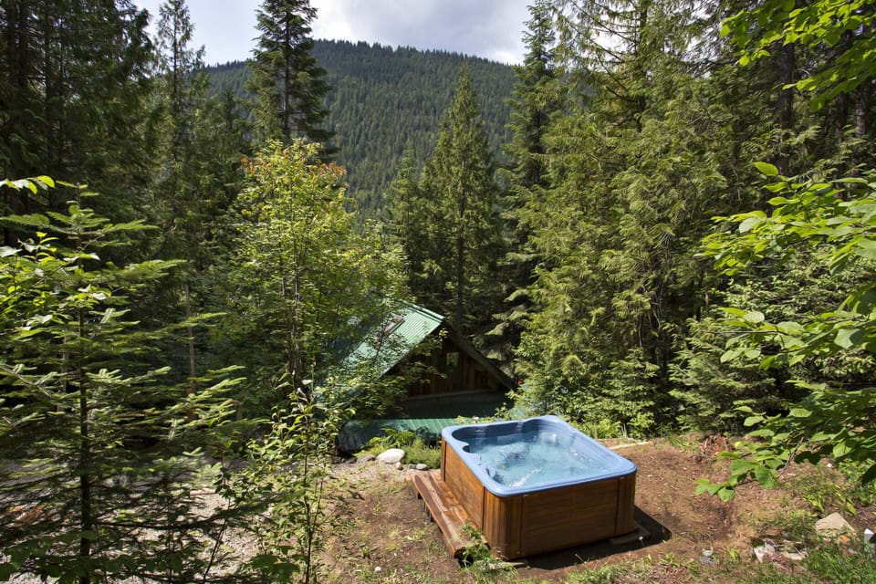 Hot tub area sits on a landing above the chalet