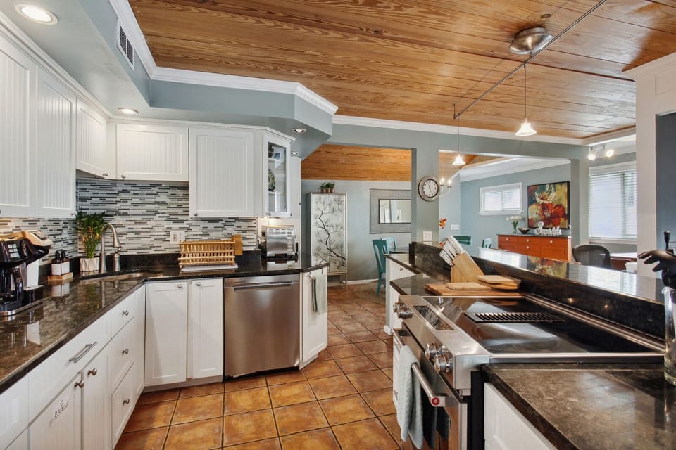 Open kitchen with plenty of counter space, storage and seating.