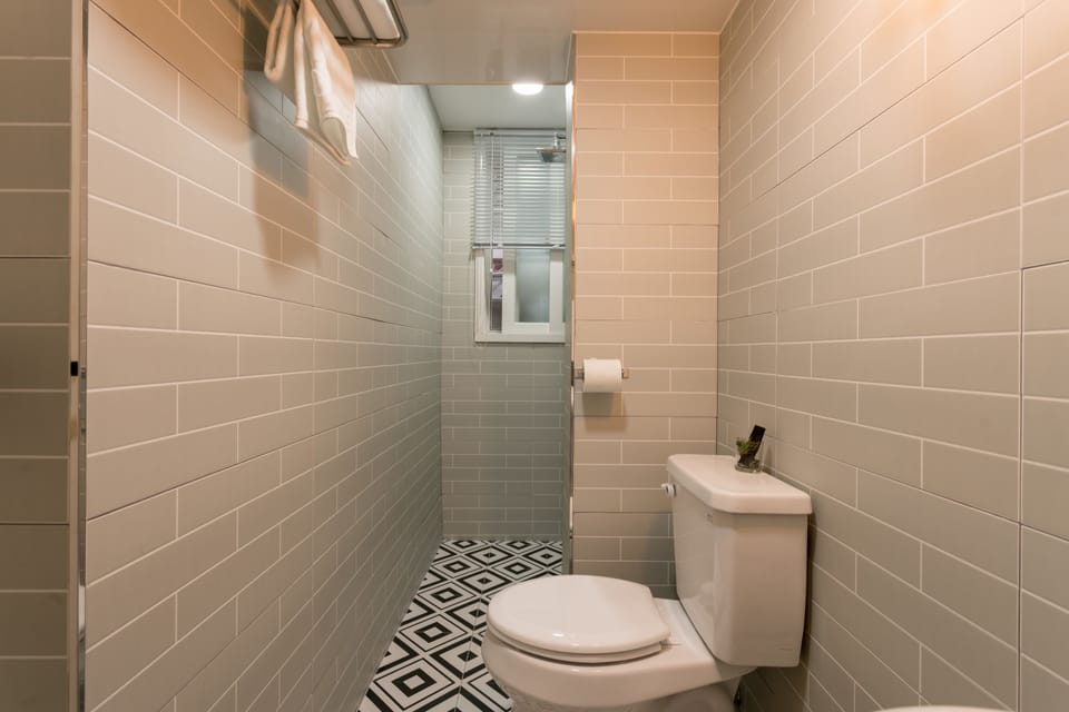 Deluxe Triple Room (Foreigner Only, Must notify the hotel of your check-in time) | Bathroom | Shower, free toiletries, hair dryer, slippers