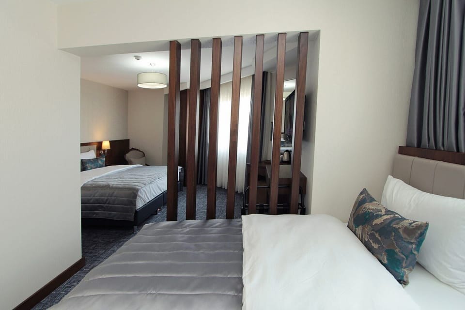 Family Suite | Premium bedding, minibar, in-room safe, blackout drapes