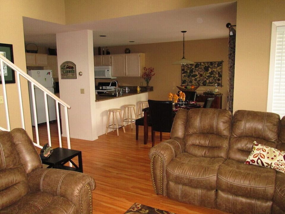 View for the living room looking into dining room and kitchen area.