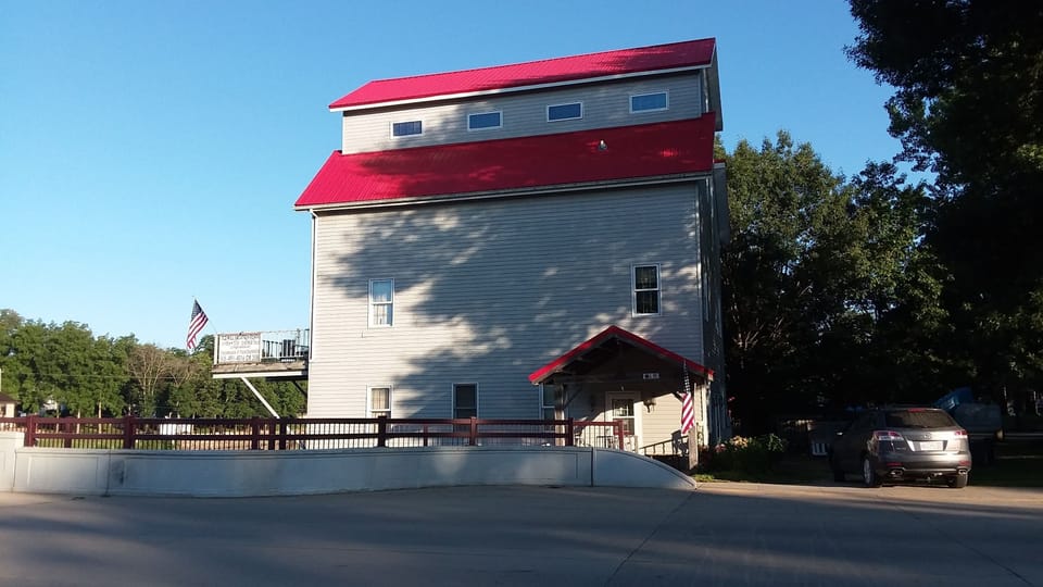 Mill's new roof from North Cherry Street. Enter street unit under red porch roof