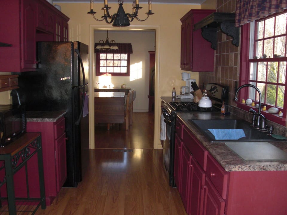 Full kitchen which includes microwave, toaster oven and coffee maker