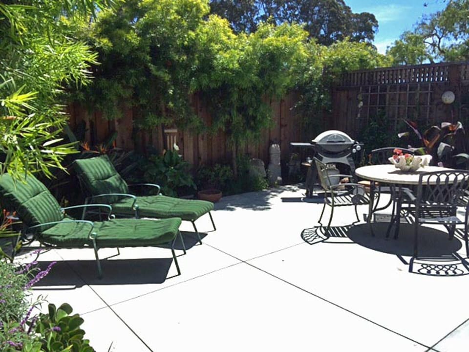 Private outdoor patio with gas grill and warm outside shower