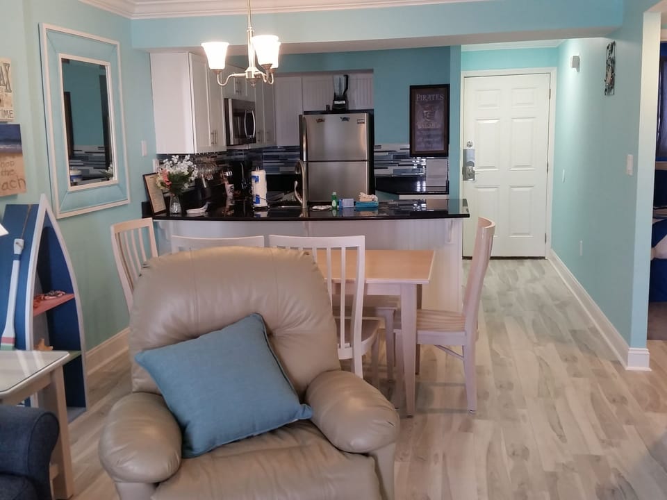Fully equipped kitchen with stainless steel appliances.