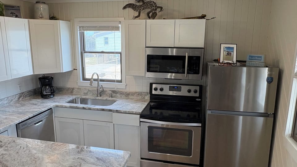New cabinets, granite and refrigerator.