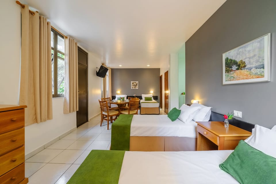 Quadruple Room | Minibar, in-room safe, desk, soundproofing