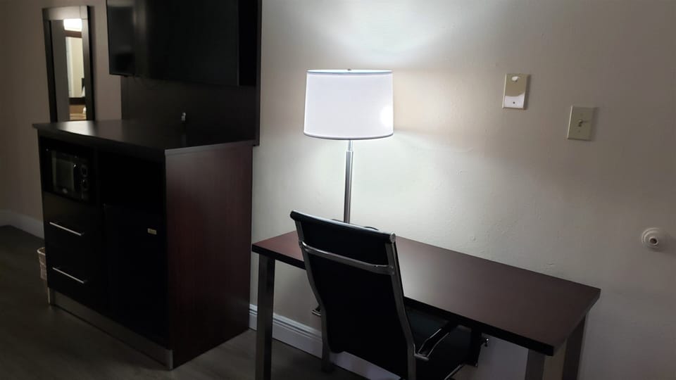 Desk, laptop workspace, iron/ironing board, free cribs/infant beds