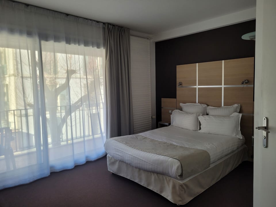 Comfort Room | Premium bedding, blackout drapes, soundproofing, iron/ironing board