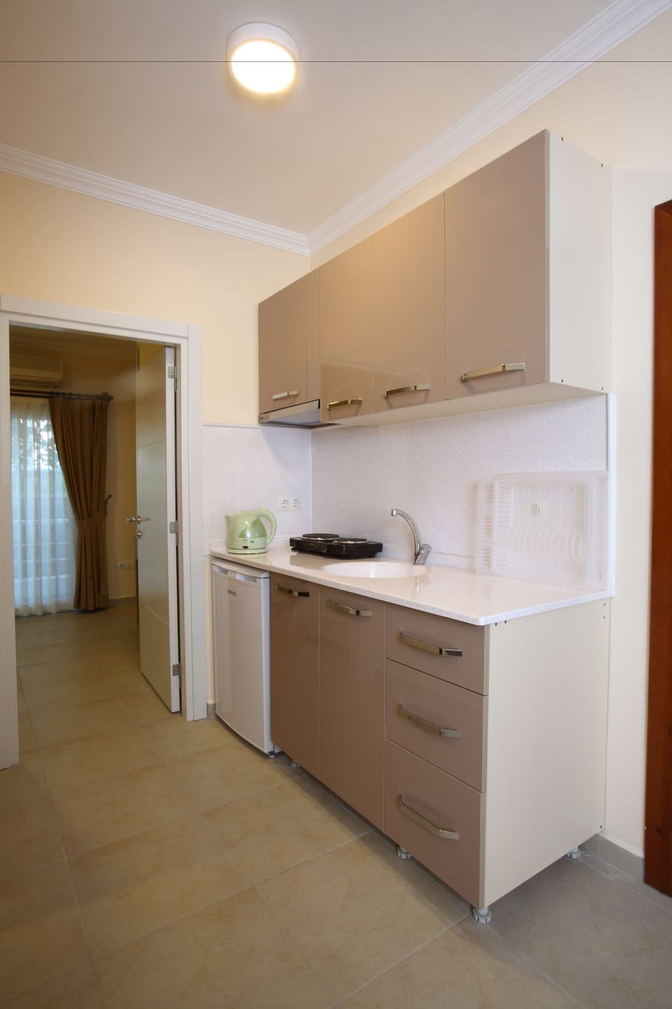 Apartment, 1 Bedroom | Private kitchenette | Stovetop, electric kettle, toaster, highchair