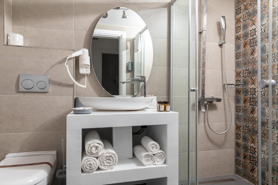 Shower, free toiletries, hair dryer, slippers