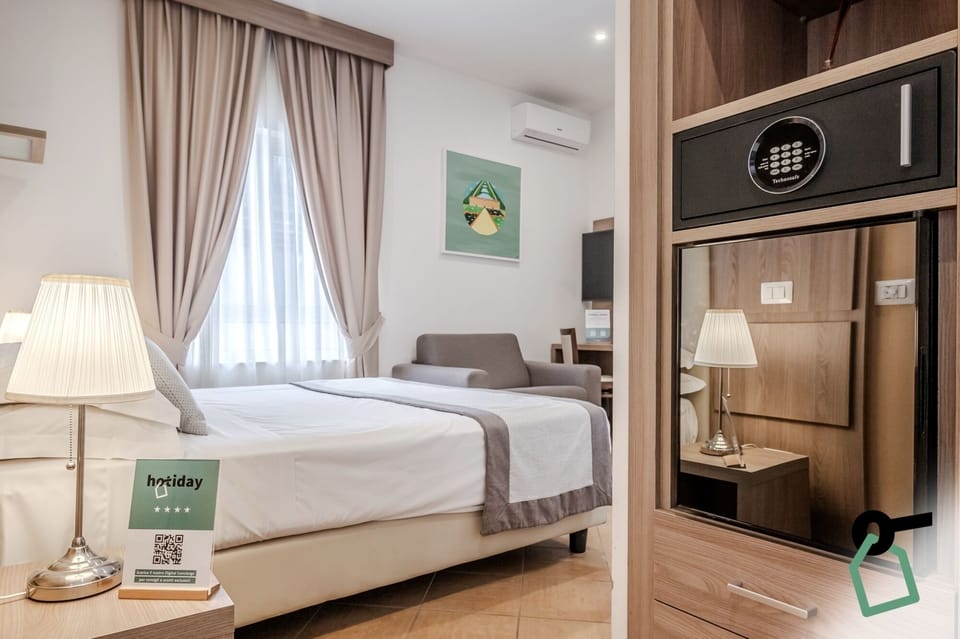Triple Room | Minibar, in-room safe, desk, soundproofing
