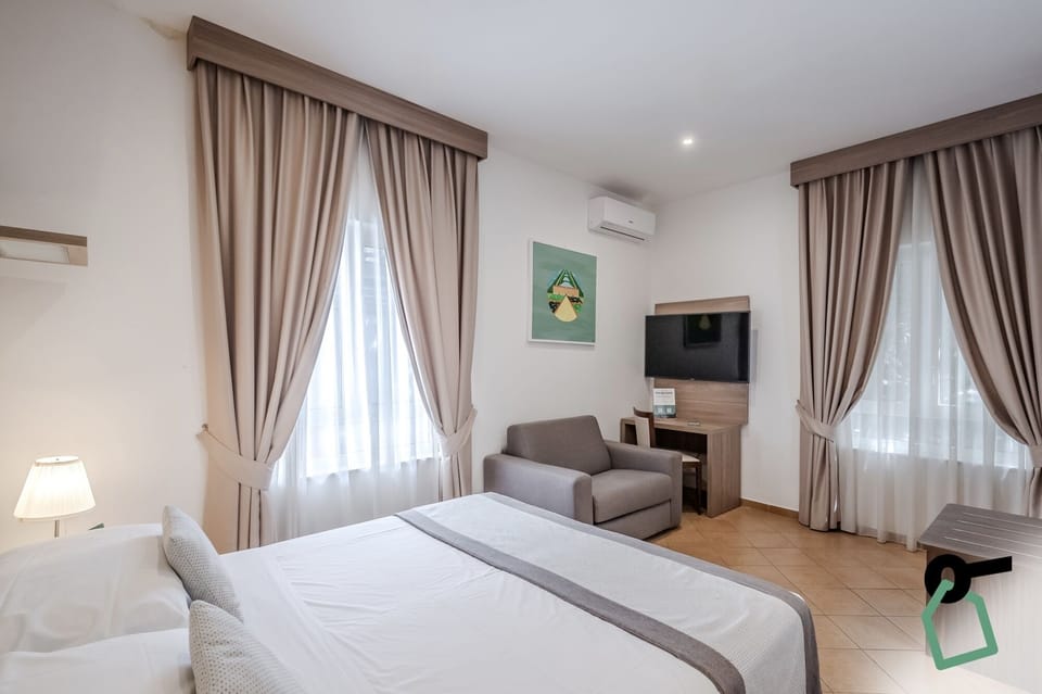 Triple Room | Minibar, in-room safe, desk, soundproofing