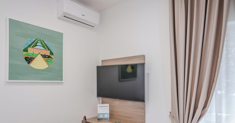 Triple Room | Minibar, in-room safe, desk, soundproofing