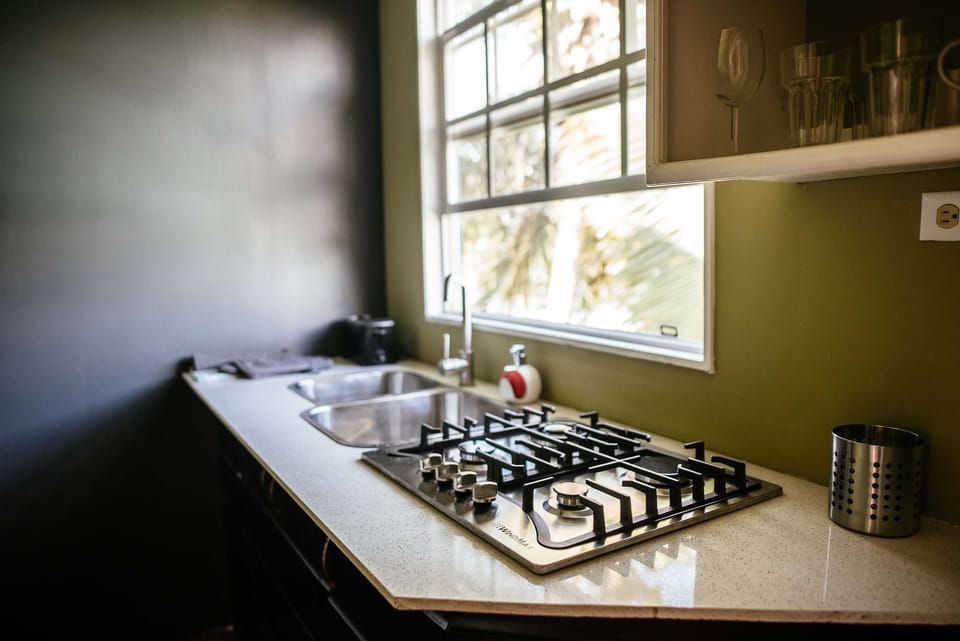 Romantic Suite, 1 Queen Bed, Patio, Partial Lake View | Private kitchen | Full-size fridge, microwave, stovetop, electric kettle