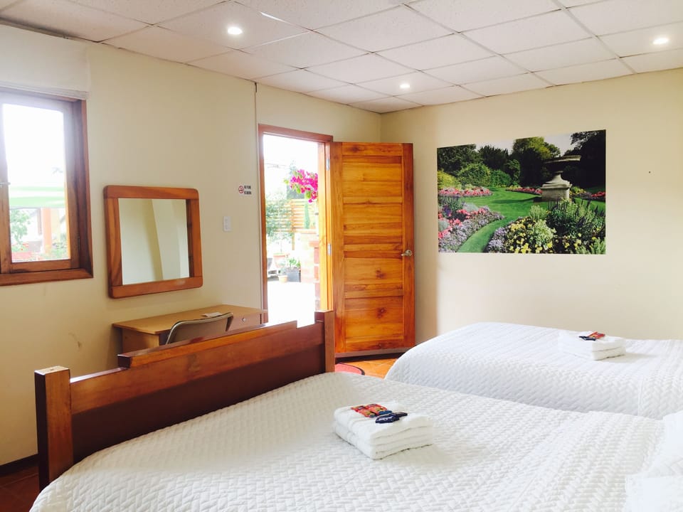 Twin Room, Multiple Beds, Garden View | WiFi (free), bed sheets