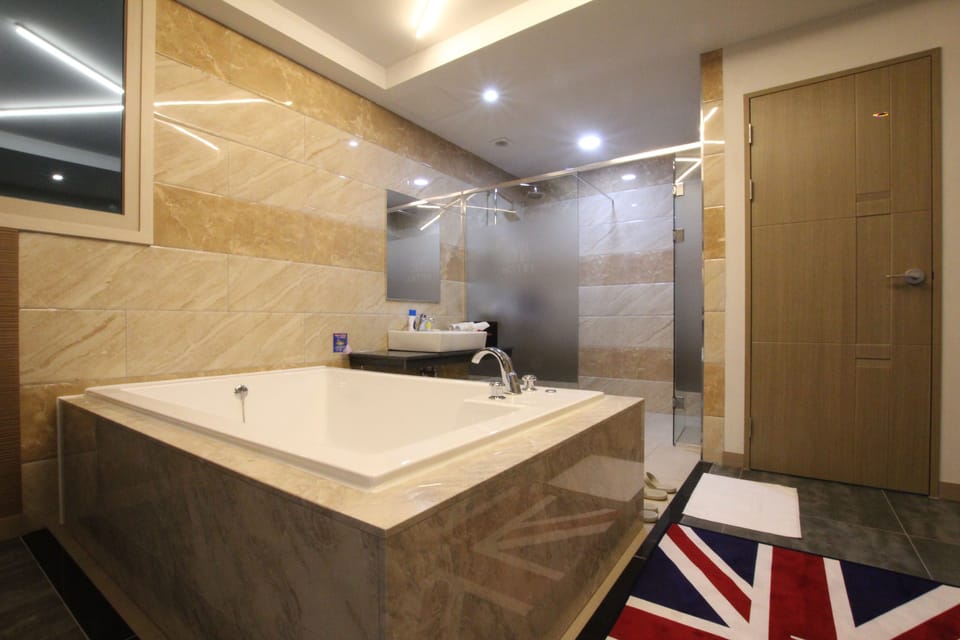 Double Room, 2 Double Beds | Bathroom | Free toiletries, bathrobes, slippers, towels