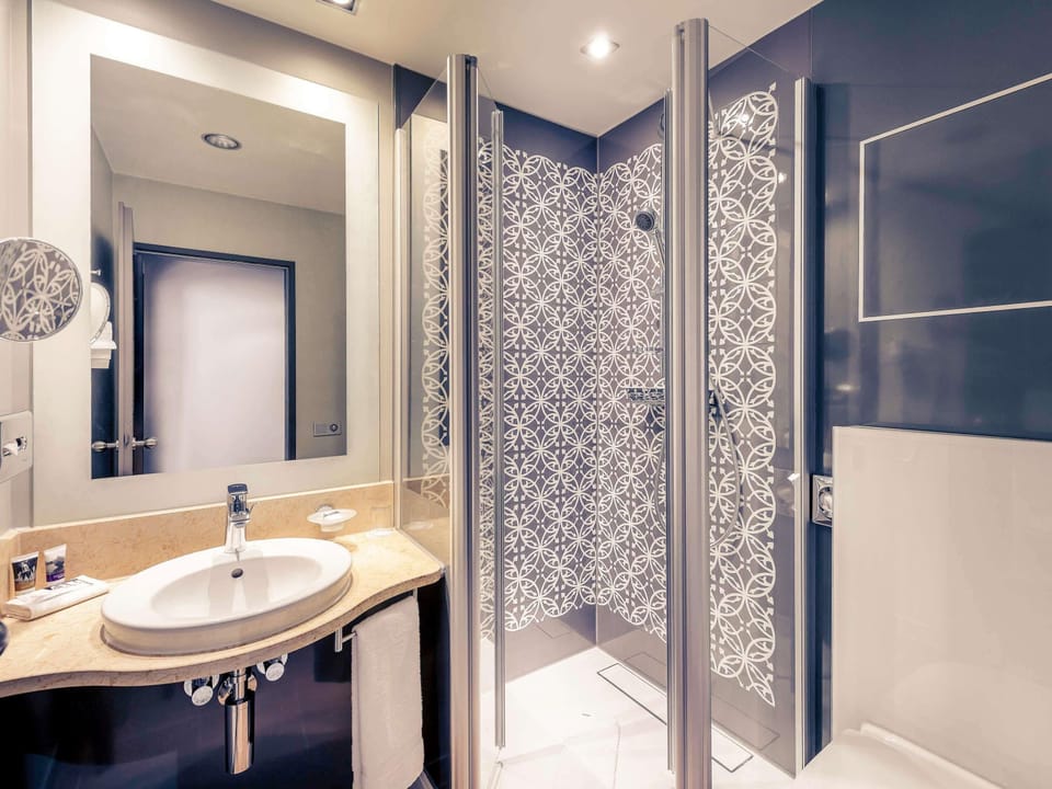 Shower, eco-friendly toiletries, hair dryer, towels
