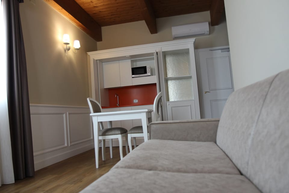 Apartment, 1 Bedroom | Living area | 32-inch flat-screen TV with digital channels, TV