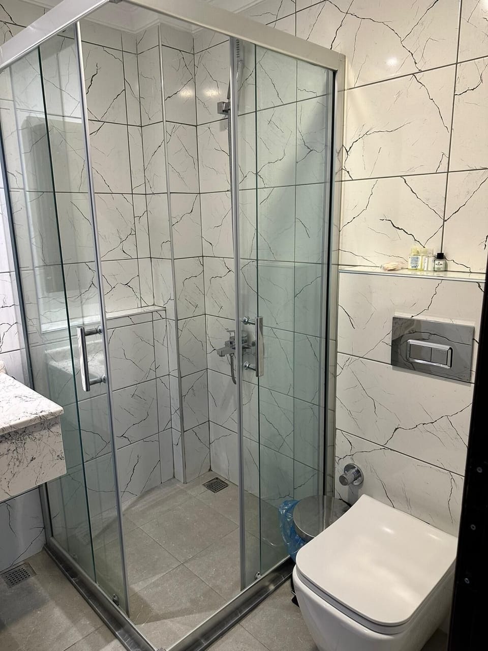 Shower, eco-friendly toiletries, hair dryer, slippers