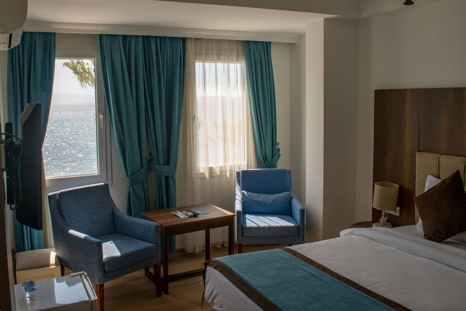 Premium bedding, desk, laptop workspace, soundproofing