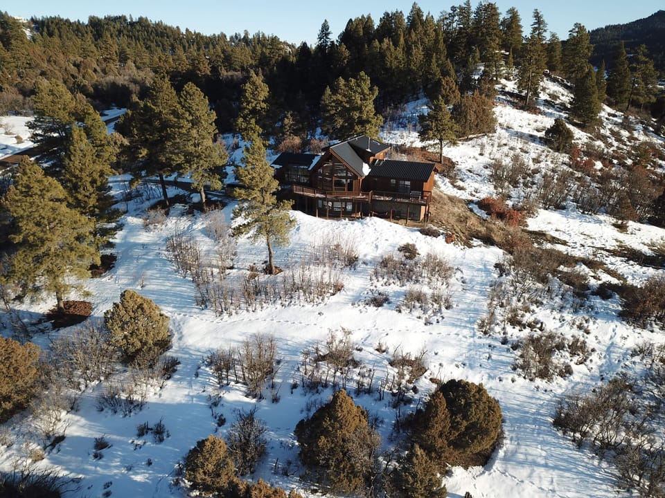 Situated on 5 acre knoll for unobstructed 360 degree views 