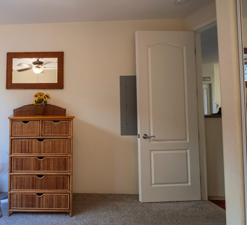 Spacious dresser in guest bedroom provides ample storage for your stay