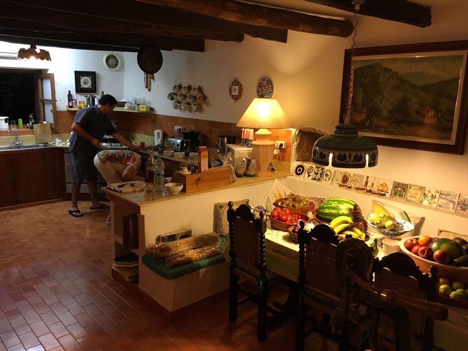 Kitchen and kitchen table with seating for 8.