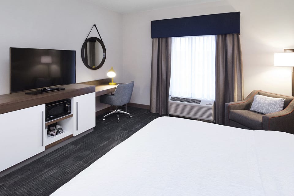 Desk, blackout drapes, soundproofing, iron/ironing board