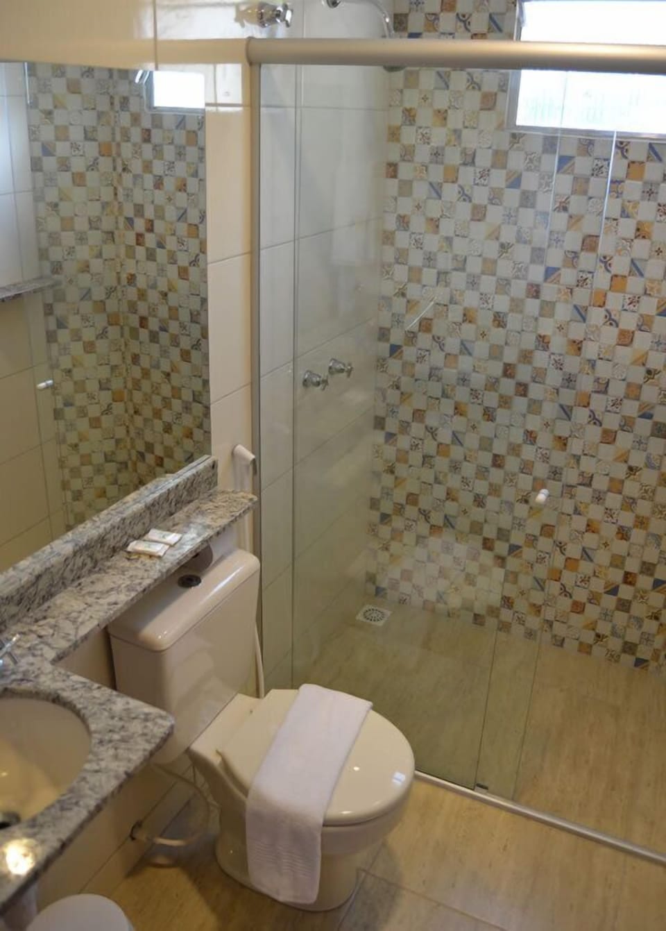 Shower, hair dryer, towels, toilet paper
