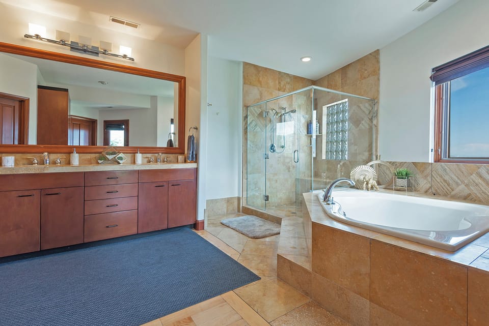 European glass shower with Italian marble and large jacuzzi jetted tub