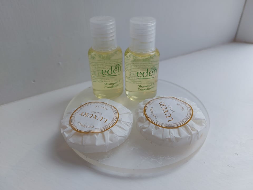 Designer toiletries, hair dryer, towels, soap