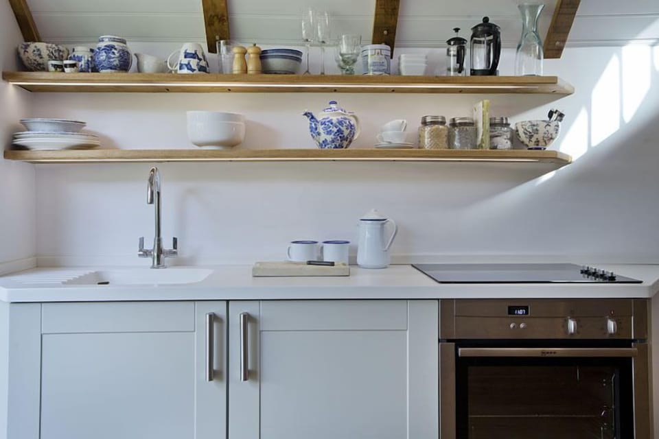 Cottage, 1 Bedroom (Low ceiling above bed) | Private kitchenette | Full-size fridge, oven, stovetop, coffee/tea maker