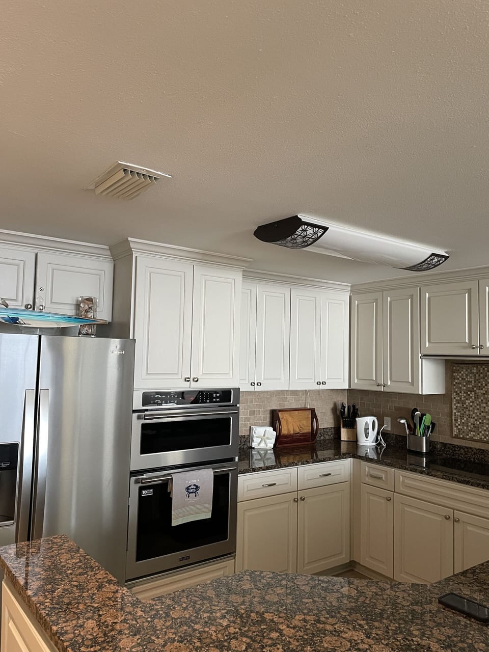 New stainless applianced kitchen with separate microwave and oven