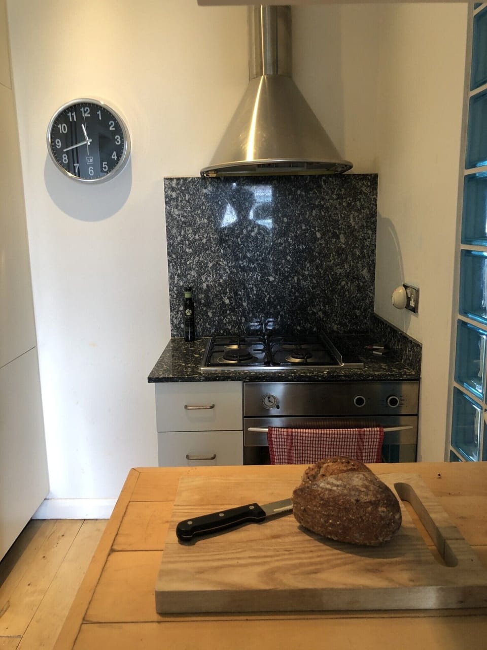 Open plan kitchen - with electric oven and gas range. 